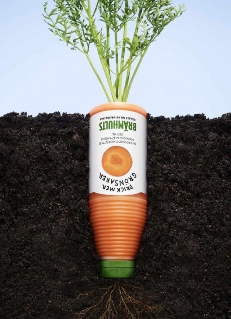 Reference: a carrot-juice bottle sprouting from the soil like a carrot